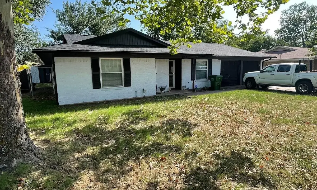 Professional roofing crew working on a residential roof in Bridgton